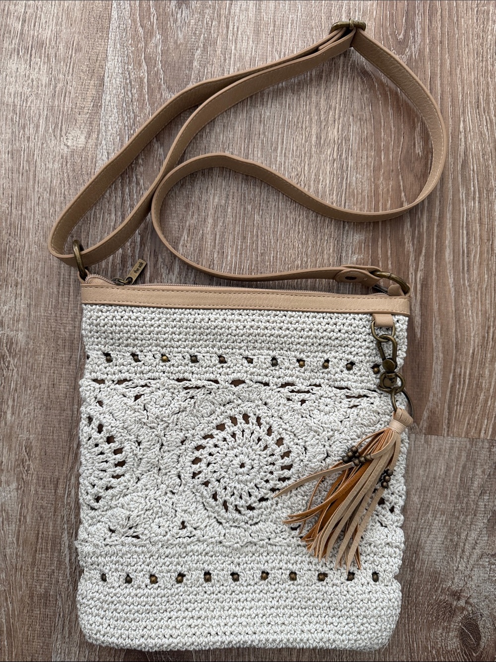 The Sak Lucia Woven Crochet Crossbody Bag with Tan Strap